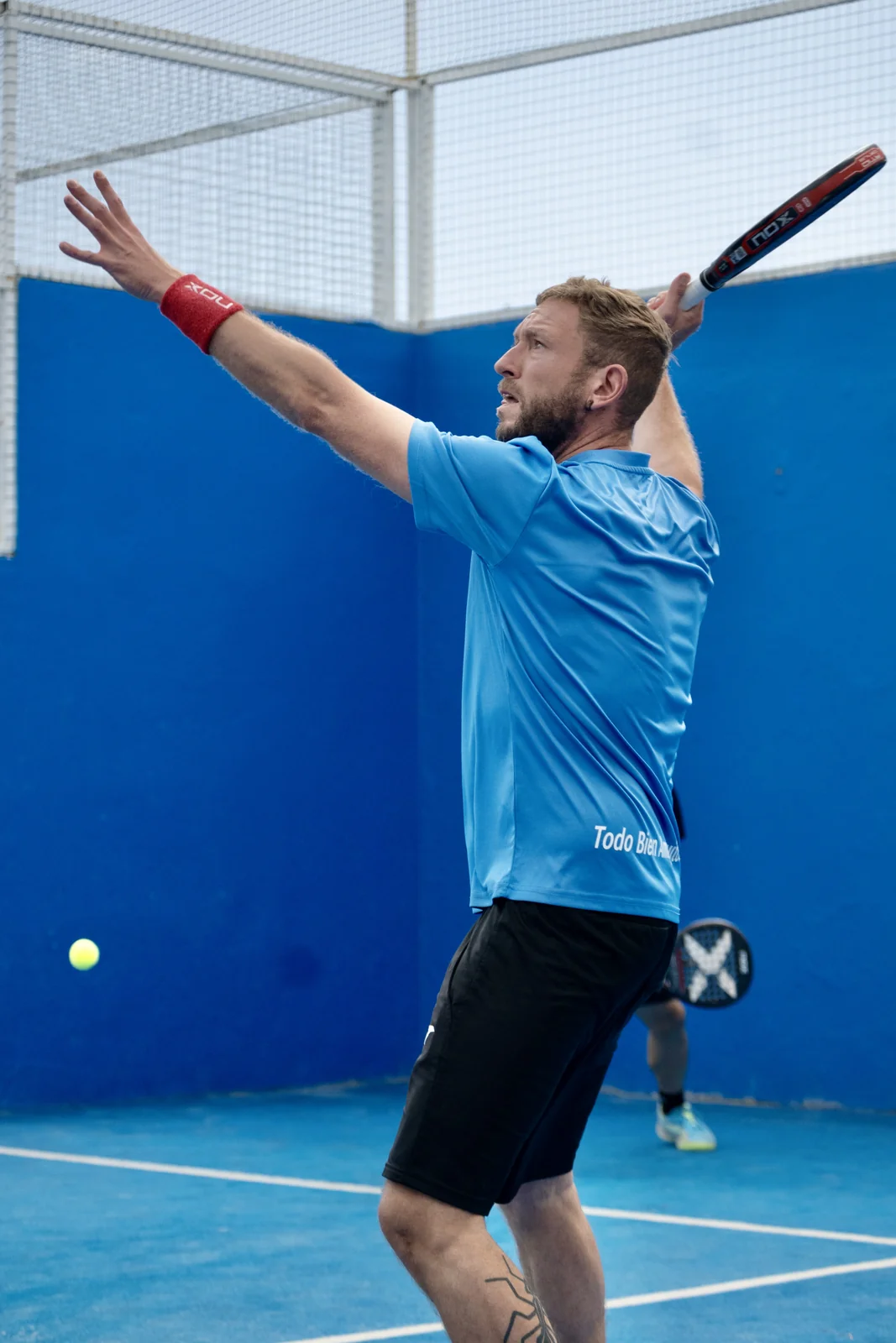 Adult pupil preparing a shot on court
