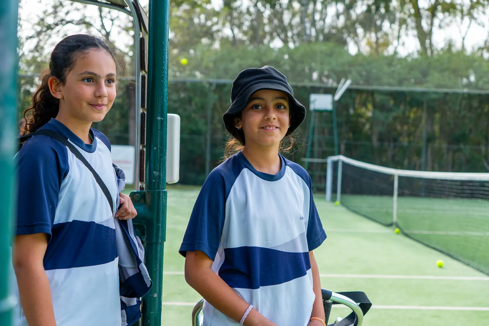 Two students of the school in the club kit