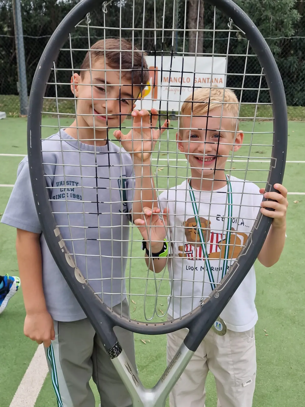 Students behind a giant racket